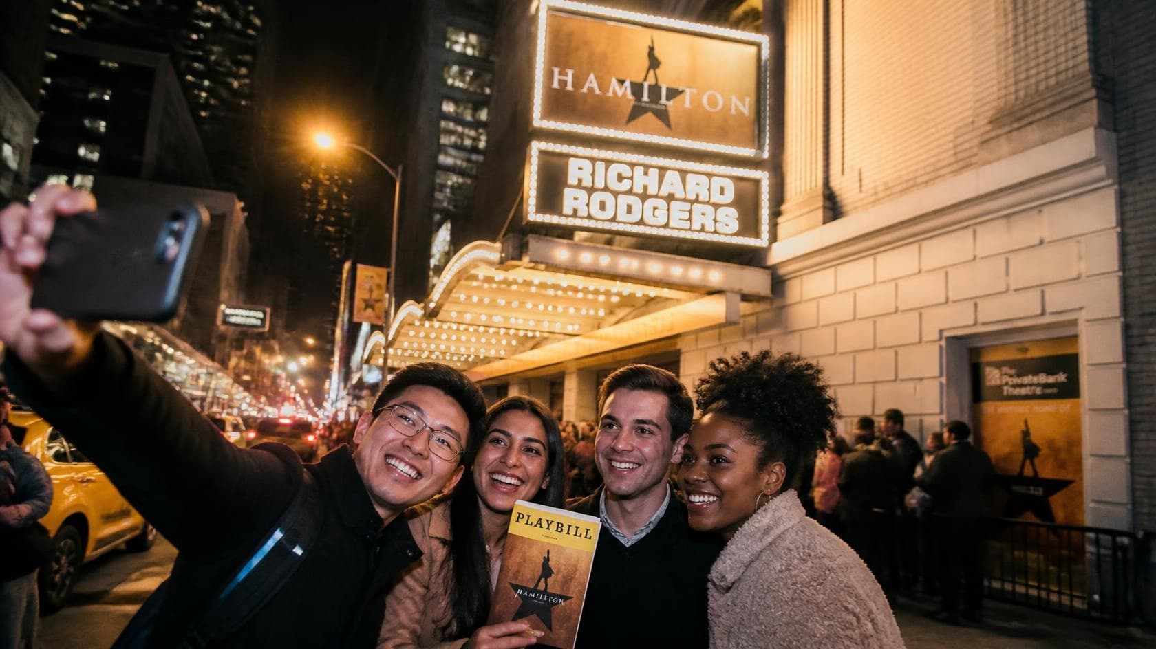 Candid street-style photograph of an excited traveler couple standing outside the Richard Rodgers Theatre in NYC during twilight.